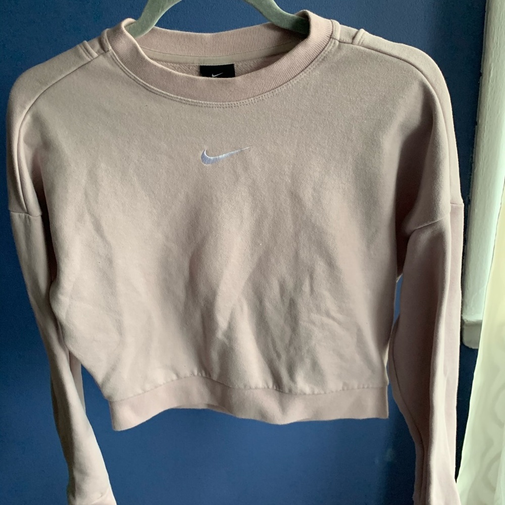 Mauve Nike sweater.